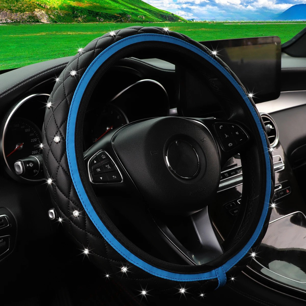 Dryyver Vibe™ CrystalEdge avec liseré bleu, surpiqûres en losange et strass scintillants sur fond noir matelassé.